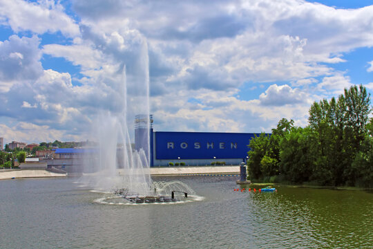 Vinnytsia, Ukraine - July 13, 2013 : View of Roshen confectionery factory and fountain on summer cloudy day