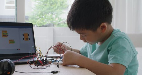 Small kid children make coding scratch car upskill STEAM lifestyle.