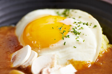 Curry and fried egg on a plate 