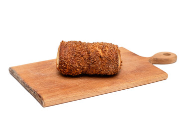 trdelnik on a wooden board on a white background