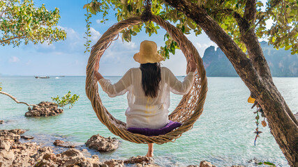 Traveler woman relaxing on straw nests joy nature scenic landscape Railay beach Krabi, Attraction leisure tourist travel Phuket Thailand summer holiday vacation trip, Beautiful destination place Asia - obrazy, fototapety, plakaty
