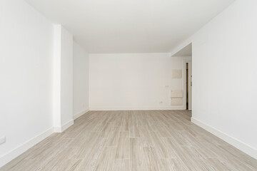 Fototapeta na wymiar Unfurnished living room with white painted walls with ceramic stoneware floors