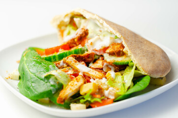 Mediterranean style pitta prepared with spicy chicken, cucumber, tomato, salad and mayo sauce