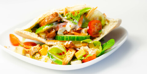 Mediterranean style pitta prepared with spicy chicken, cucumber, tomato, salad and mayo sauce