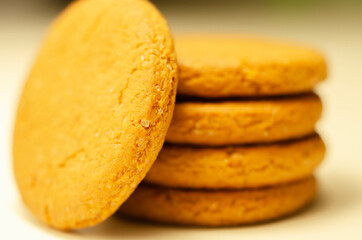 Close up on a stack of cinnamon oat cookies on a white background