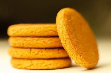 Close up on a stack of cinnamon oat cookies on a white background