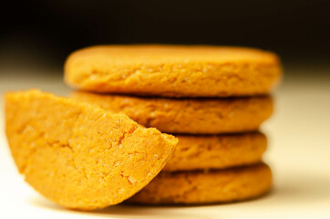 Close up on a stack of cinnamon oat cookies on a white background