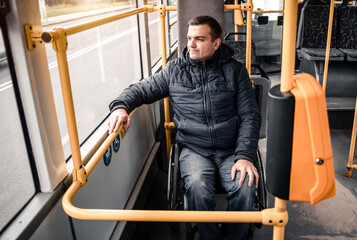Person with a physical disability inside public transport with an accessible ramp.