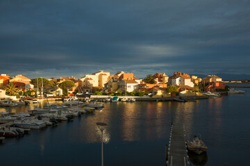 Fototapeta premium Le Barcares Nautides Marina in France with View on the Canigou Mountain Chain at Sunset