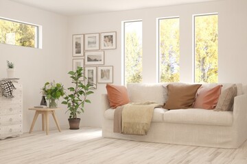 Stylish room in white color with sofa and autumn landscape in window. Scandinavian interior design. 3D illustration
