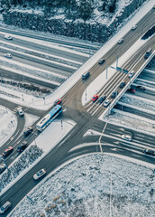 Street intersection in winter, aerial view. Low traffic on snowy winter day