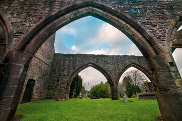 Fototapeta premium Muthill Old Church & Tower. Scotland. U.K is a 12th century medieval church with a tall Romanesque tower, all that remains of an important early Christian site linked to the cathedral at Dunblane. 
