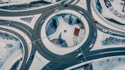 Street intersection in winter, aerial view. Low traffic on snowy winter day