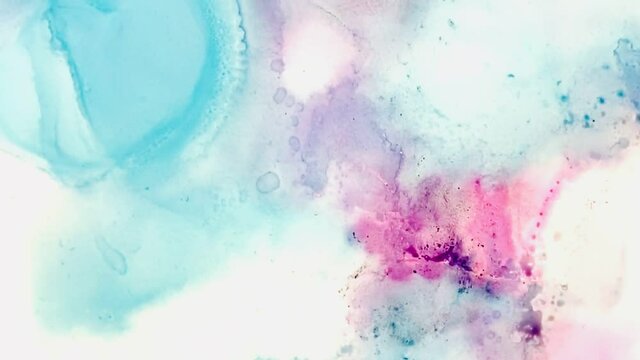 bright pink and blue alcohol ink watercolour background in bled gradient purple pink tones video footage pan