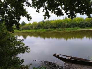 Obraz premium sunken boat on the river