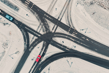 Street intersection in winter, aerial view. Low traffic on snowy winter day