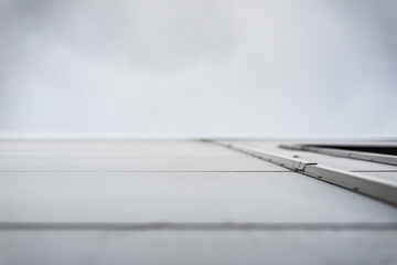Building element. Modern architecture. Design project. Smooth surface. Steel construction. Metal panel. New building. Focus on the wall. Close-up view from the surface of the wall.