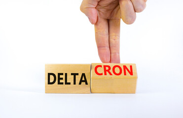 Covid-19 delta and deltacron symbol. Doctor turns a cube and changes the word delta to deltacron....