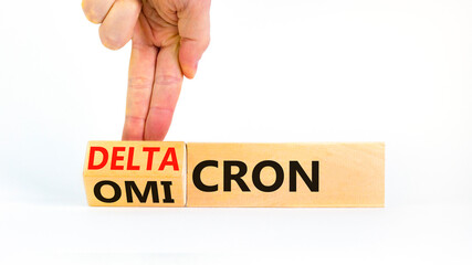 Covid-19 omicron or deltacron symbol. Doctor turns a cube and changes the word omicron to...