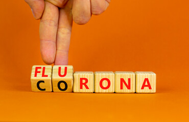 Covid-19 corona and flu flurona symbol. Doctor turns cubes and changes the word corona to flurona....