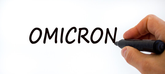 New covid-19 omicron variant strain and flu corona symbol. Doctor hand with black marker. The...