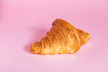 Croissant isolated on purple background