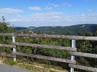 Fototapeta na wymiar View from the circular path of the Glinge pumped hydroelectric energy storage, North Rhine-Westphalia, Germany, of the mountains and forests of the Sauerland Blick vom Rundweg des Speicherwerks Glinge