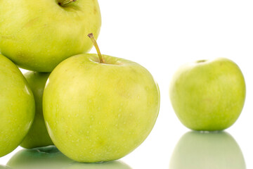 Several sweet green apples, close-up, isolated on white.