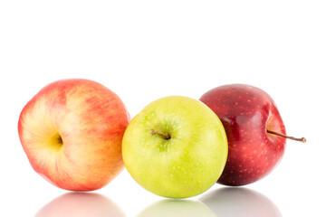 Three juicy apples, green and two red, close-up, isolated on white.
