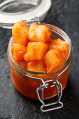 Korean fermented Radish Kimchi in glass jar. Healthy food.