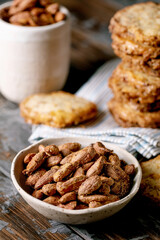 Sweet homemade snacks roasted almond nuts and shortbread cookies