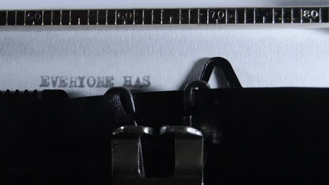Typing EVERYONE HAS A STORY with an old manual typewriter
