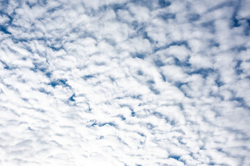 Texture in the form of blue sky and white clouds..
