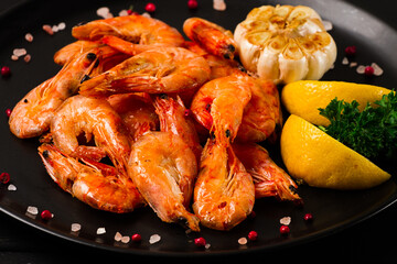 Fried shrimp, on a black background, top view, no people,