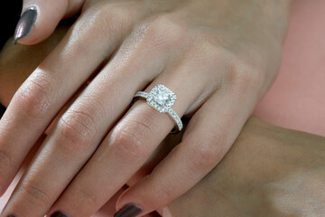 Diamond jewelry. Diamond rings on woman finger