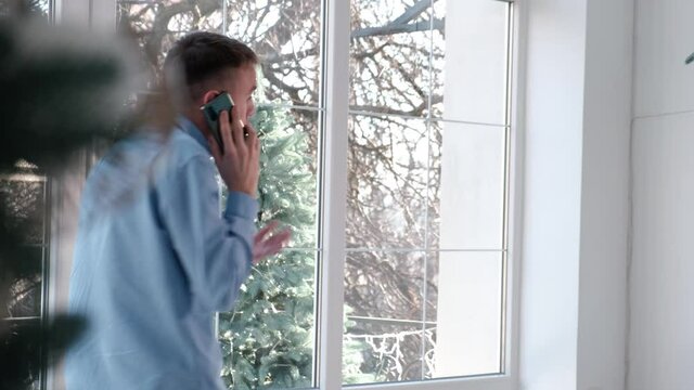 A man is nervous and emotionally talking on the phone