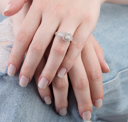 Diamond jewelry. Diamond rings on woman finger