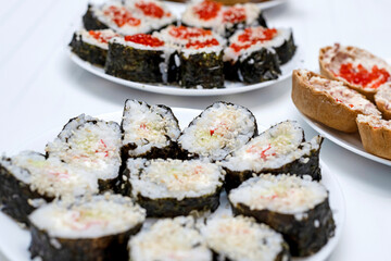 Homemade sushi on the festive table, Japanese food, holidays.