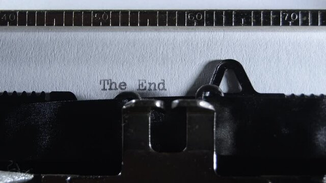 Typing The End with an old manual typewriter