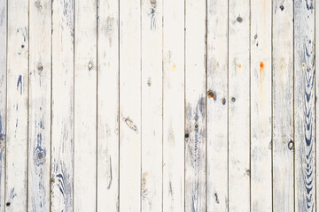 White wooden planks on wall with damp patches