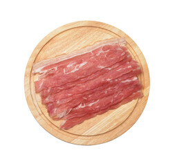 Top view of bacon strips on wooden cutting board