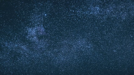 Blue Night Starry Sky With Glowing Stars. Bright Glow Of Sky Stars And Milky Way Galaxy. 4K. Natural Background Backdrop