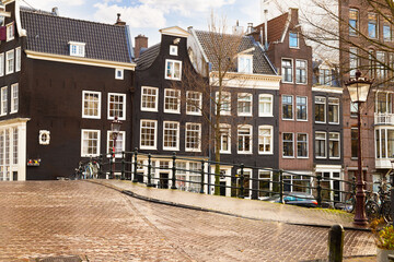 Historic old canal houses on the Reguliersgracht in the center of Amsterdam.