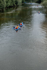 Group of people in the canoe paddling in holiday time