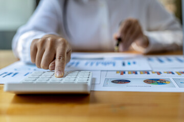 The company's finance manager is using a calculator, he uses a calculator to calculate the numbers in the company's financial documents that employees in the department create as meeting documents.