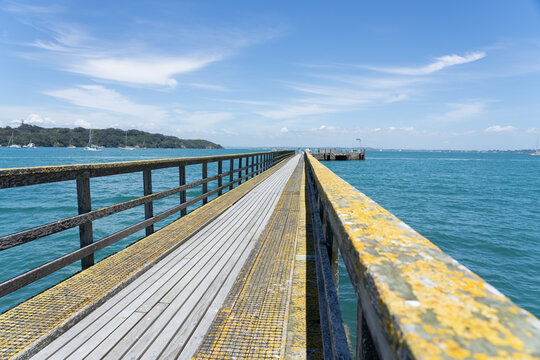 Long Leading Lines Of Never Ending Jetty On Motuihe Island , Auckland New Zealand.