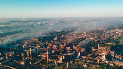 Naklejka premium factory smoke from chimneys from a height panorama