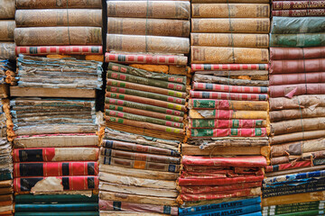 Old weathered books background and natural texture
