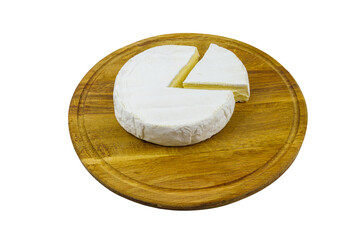 Piece of brie cheese on cutting board isolated on white background