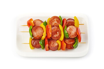 Pork sausage kebab and vegetables BBQ, close-up, isolated on white background.